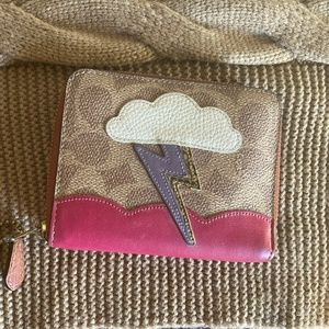 Brown Lightning Bolt Coach Wallet with Red Interior and Zipper